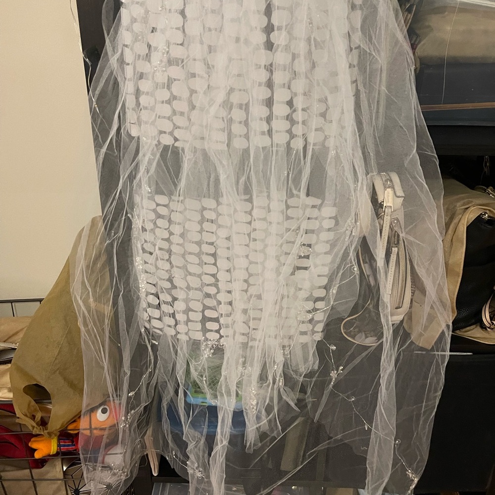 White Alexia Couture Size 4 with tooling underskirt and veil. Like new